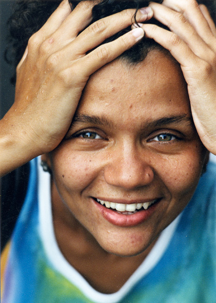 Smiling latin woman looking directly at you